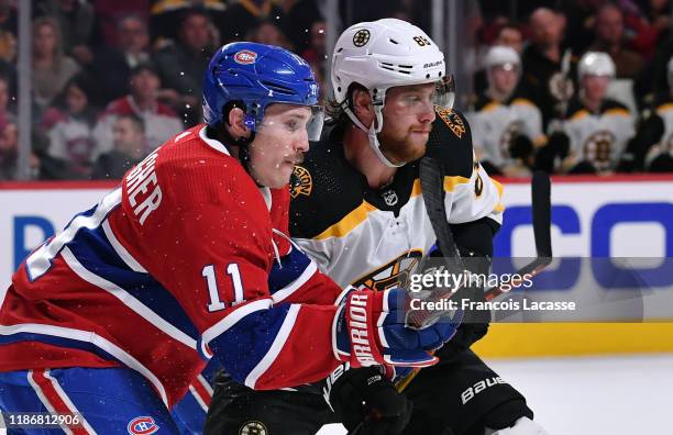 Brendan Gallagher of the Montreal Canadiens skates against David Pastrnak the Boston Bruins in the NHL game at the Bell Centre on November 5, 2019 in...