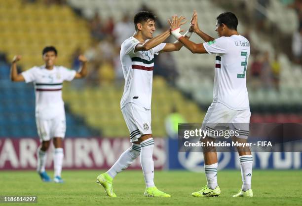 Alejandro Gomez of Mexico celebrates the victory with Victor Guzman of Mexico during the quarterfinal match between Korea Republic and Mexico in the...