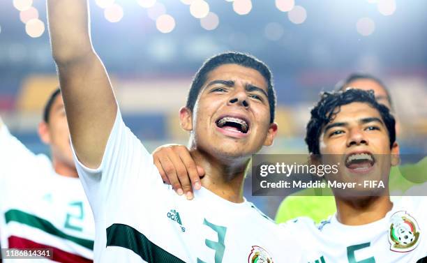 Victor Guzman of Mexico and Rafael Martinez of Mexico celebrate the victory during the quarterfinal match between Korea Republic and Mexico in the...