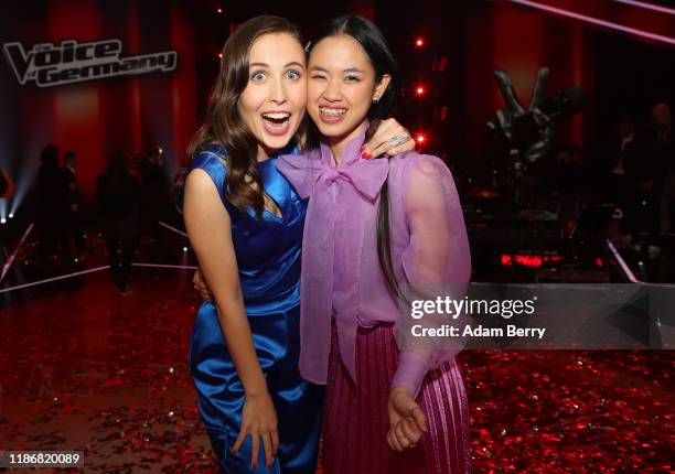 Claudia Emmanuela Santoso and Alice Merton celebrate after winning the finals of "The Voice of Germany" on November 10, 2019 in Berlin, Germany.