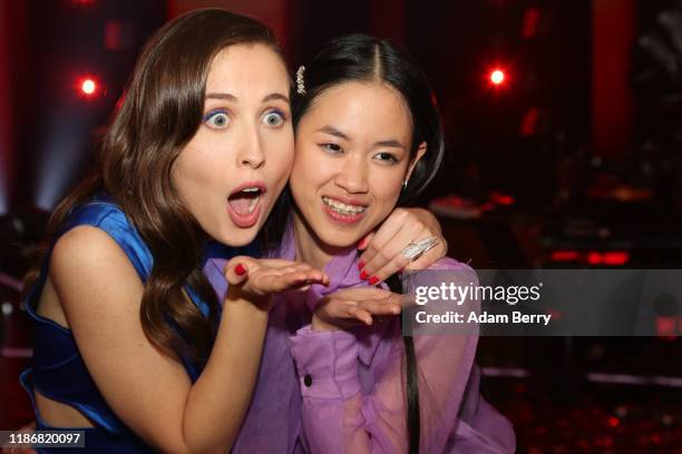 Claudia Emmanuela Santoso and Alice Merton celebrate after winning the finals of "The Voice of Germany" on November 10, 2019 in Berlin, Germany.