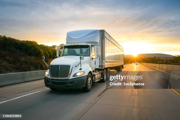 semi truck 18 wheeler on the highway at sunset - lorry bildbanksfoton och bilder