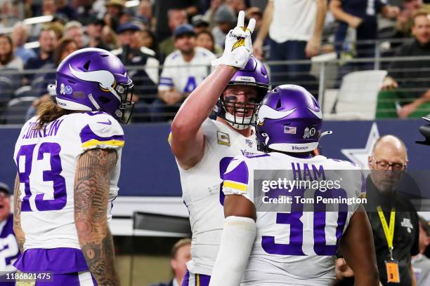 Kyle Rudolph of the Minnesota Vikings celebrates scoring his second touchdown during the first quarter against the Dallas Cowboys at AT&T Stadium on...