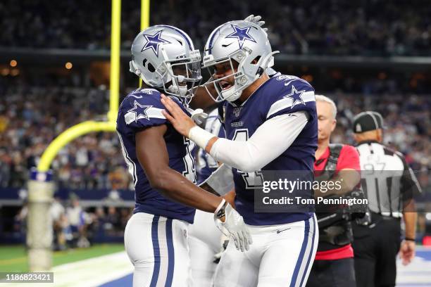 Michael Gallup of the Dallas Cowboys celebrates with Dak Prescott after scoring a touchdown during the second quarter against the Minnesota Vikings...