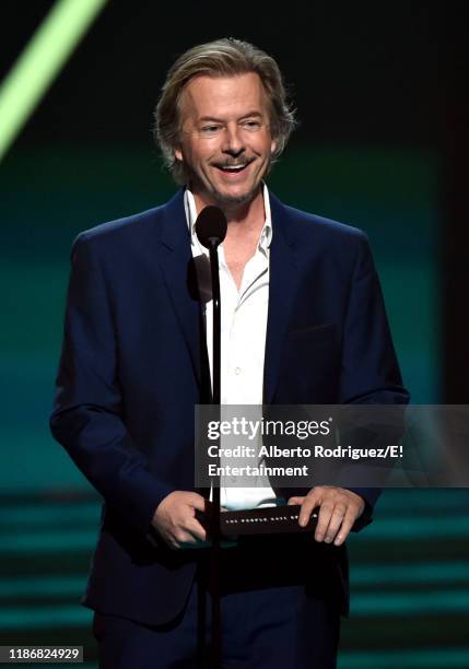 Pictured: David Spade speaks on stage during the 2019 E! People's Choice Awards held at the Barker Hangar on November 10, 2019 -- NUP_188997