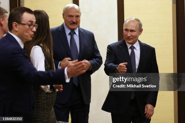 Russian President Vladimir Putin and Belarussian President Alexander Lukashenko enter the hall as Russian Presidential Protocol Chief Bladislav...