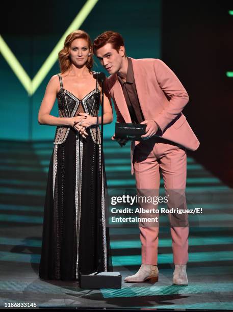 Pictured: Brittany Snow and KJ Apa speak on stage during the 2019 E! People's Choice Awards held at the Barker Hangar on November 10, 2019 --...