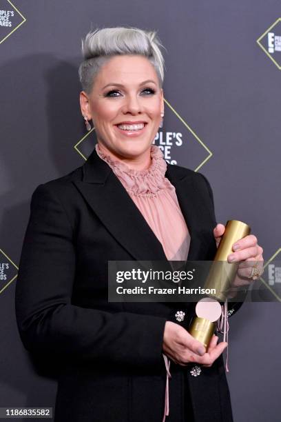 Nk, winner of People's Champion Award poses in the press room during the 2019 E! People's Choice Awards at Barker Hangar on November 10, 2019 in...