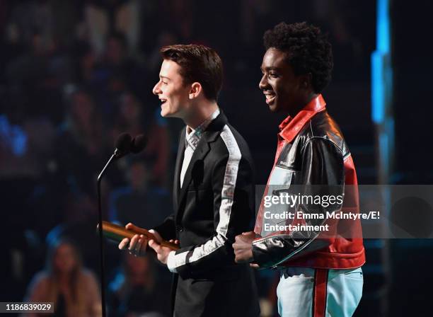 Pictured: Noah Schnapp and Caleb McLaughlin accept The TV Show of 2019 award for 'Stranger Things' on stage during the 2019 E! People's Choice Awards...