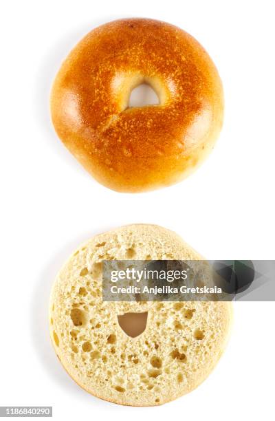 fresh bagels isolated on white background - halved stock-fotos und bilder