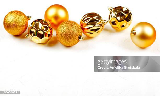 christmas golden ornaments on white background. christmas decoration. christmas card. - christmas bauble isolated stock pictures, royalty-free photos & images
