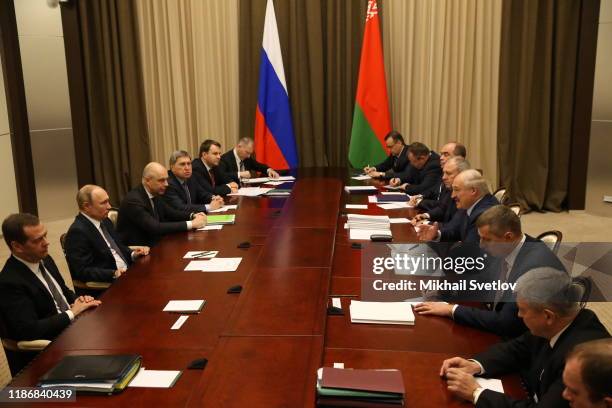 Russian President Vladimir Putin looks on Belarussian President Alexander Lukashenko during Russian-Belarussian talks at Bocharov Ruchey Presidential...