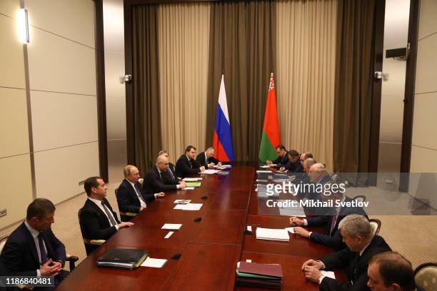 Russian President Vladimir Putin looks on Belarussian President Alexander Lukashenko during Russian-Belarussian talks at Bocharov Ruchey Presidential...