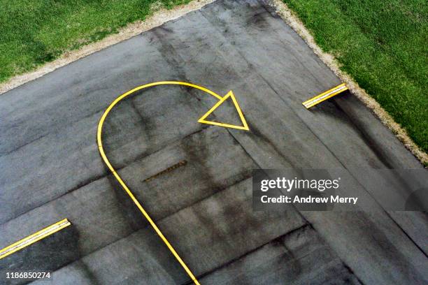 yellow arrow sign on airport runway, aerial view - backa bildbanksfoton och bilder