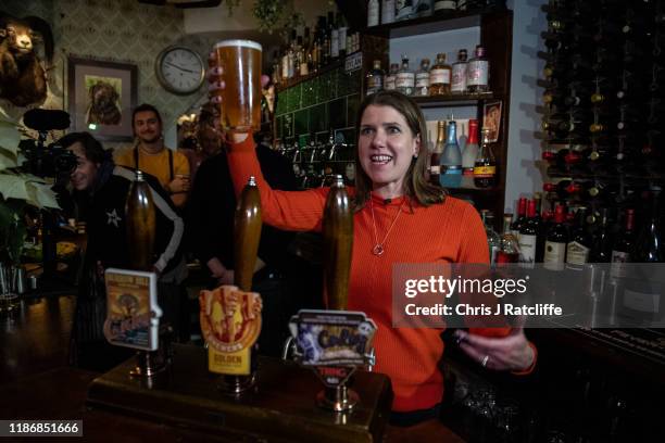 Liberal Democrat party leader Jo Swinson pours a pint of beer in Dylans - The Kings Arms whilst campaigning for the general election on December 7,...