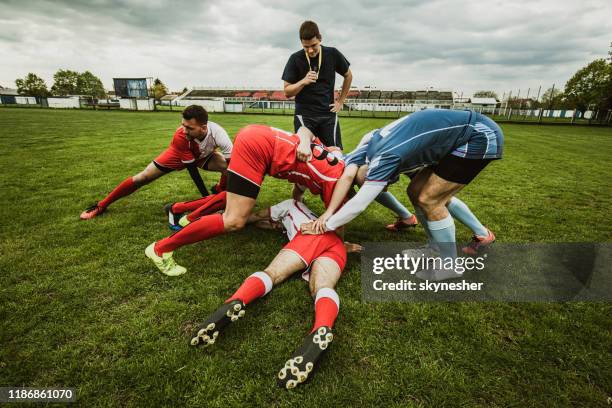 scrum action on rugby match! - referee stock pictures, royalty-free photos & images