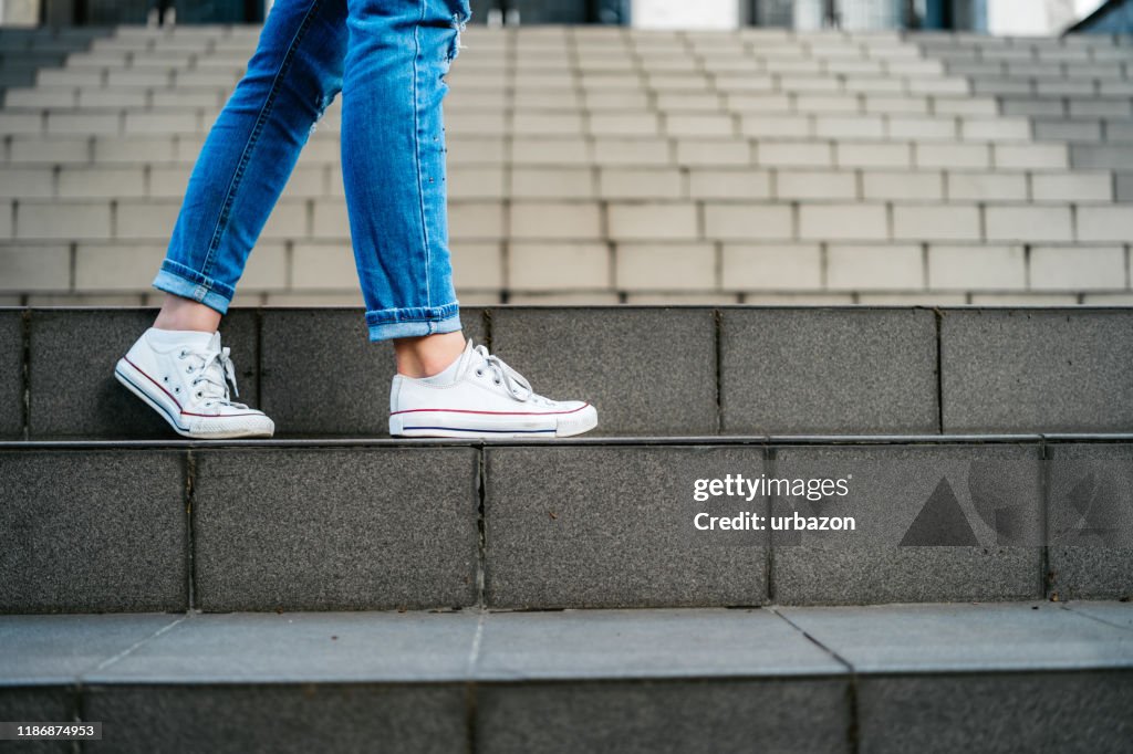 Woman going down the stairs