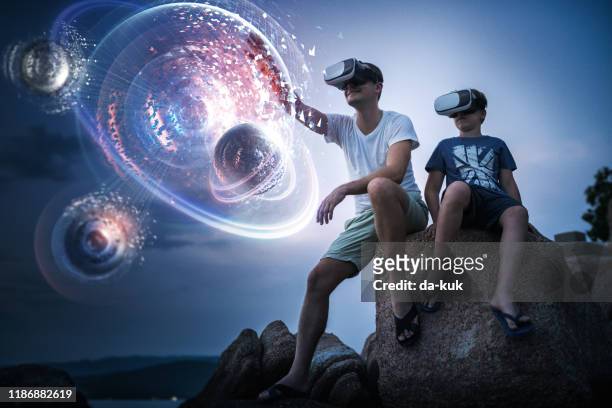exploring futuristic planetary system in virutal reality - vr headset kid stock pictures, royalty-free photos & images