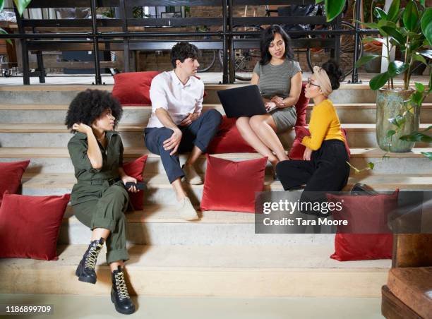 group of people sitting on stairs with laptop - chinese student laptop stock pictures, royalty-free photos & images