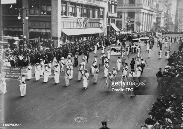 Suffragettes of the Congressional Union for Woman Suffrage marching during a parade in New York City, US, circa 1913; the women at the front are...