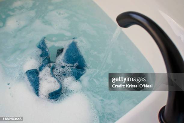 bubble bath - washcloth stock-fotos und bilder