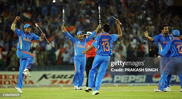 Indian cricketers celebrate victory over Pakistan during the ICC Cricket World Cup 2011 semi-final match between India and Pakistan at The Punjab...