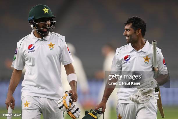 Babar Azam and Asad Shafiq of Pakistan walk from the field at stumps during the International Tour match between Australia A and Pakistan at Optus...