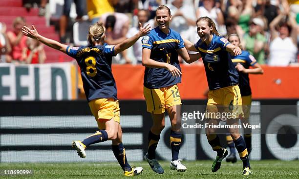 Ellyse Perry of Australia celebrates scoring the first goal with Emily van Egmond and Elise Kellond-Knight during the FIFA Women's World Cup 2011...