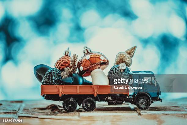 cute little car truck with christmas toy on wooden background - small truck bildbanksfoton och bilder