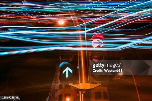 traffic lights at luminous night in madrid city, long exposure - can't decide where to go stock pictures, royalty-free photos & images