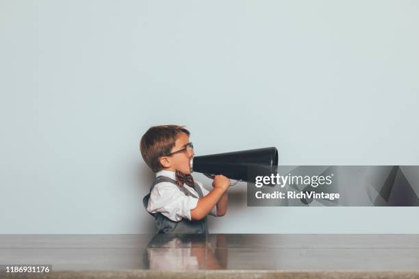 young nerd boy with megaphone - interview funny stock pictures, royalty-free photos & images