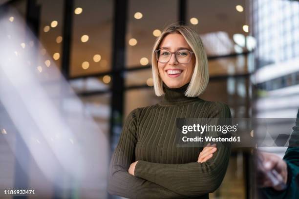 portrait of confident young woman in the city - blonde business woman stock pictures, royalty-free photos & images