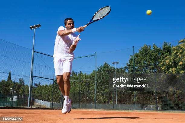tennis player during a tennis match - colpire foto e immagini stock