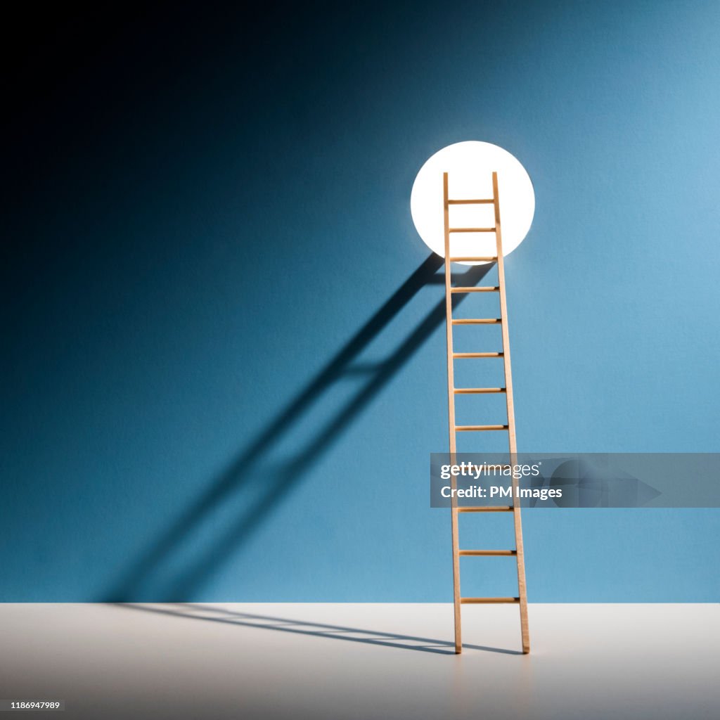 Ladder through hole in wall