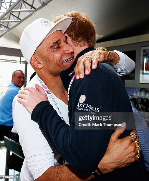 Prince Harry meets musician Goldie in the Red Bull Racing Energy Station before the British Formula One Grand Prix at the Silverstone Circuit on July...