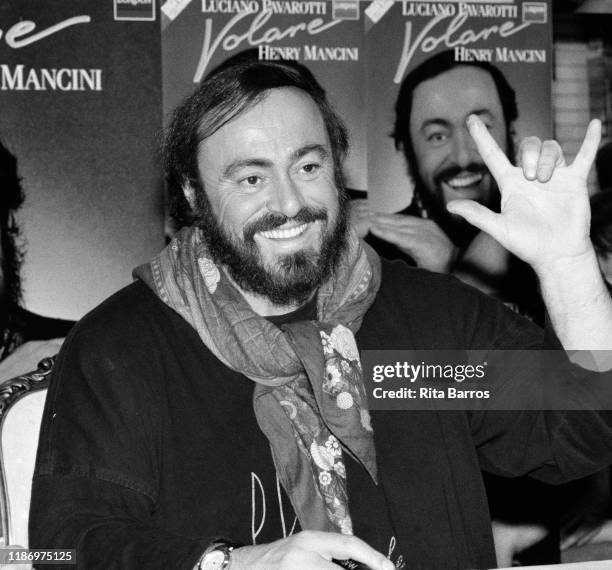Italian tenor Luciano Pavarotti smiles during a signing of his album, 'Volare,' held at a Sam Goody record store, New York, New York, December 2,...