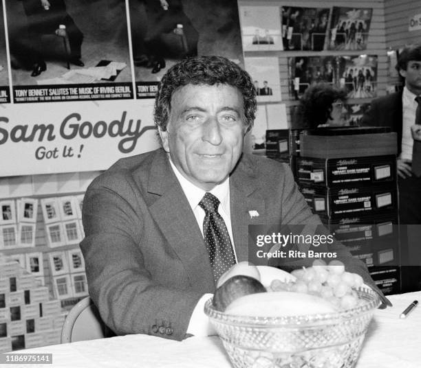 Portrait of American Pop and Jazz singer Tony Bennett during a signing for his album, 'Bennett/Berlin,' at a Sam Goody record store, New York, New...