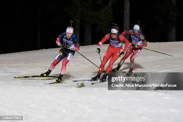 Johannes Dale of Norway, Jules Burnotte of Canade and Krasimir Anev of Bulgaria compete during the Men 4x7.5 km Relay Competition at the BMW IBU...