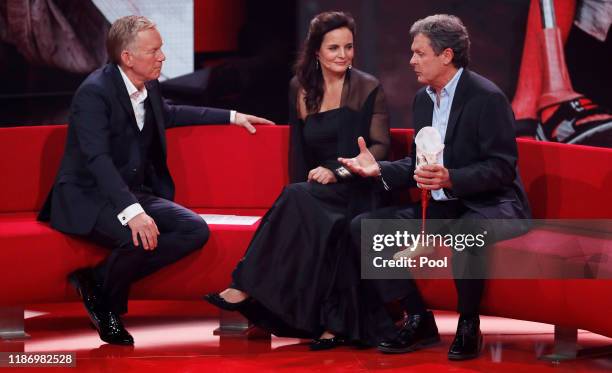 Johannes B. Kerner talks to Elisabeth Lanz and Heinz Trebbin during the Ein Herz Fuer Kinder Gala show at Studio Berlin Adlershof on December 7, 2019...