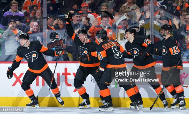 Scott Laughton, Kevin Hayes, Ivan Provorov, James van Riemsdyk and Matt Niskanen of the Philadelphia Flyers celebrate the go ahead goal against the...