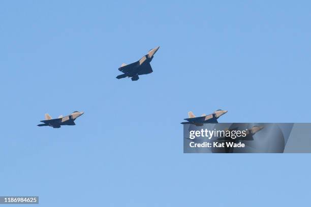 The missing man fly-over formation by the 199th Fighter Squadron, Hawaii National Guard, 19th Fighter Squadron, U.S. Airforce as Pearl Harbor...