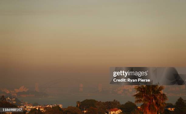 Smoke covers the city of Sydney at sunrise on November 12, 2019 in Sydney, Australia. More than 60 fires are burning across NSW with 200 homes and...