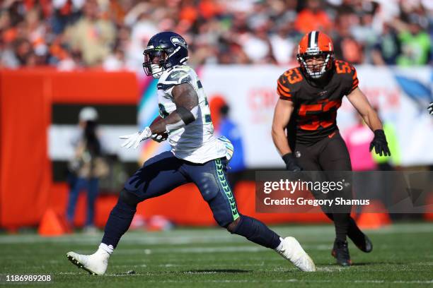 Chris Carson of the Seattle Seahawks runs the ball against the Cleveland Browns at FirstEnergy Stadium on October 13, 2019 in Cleveland, Ohio.