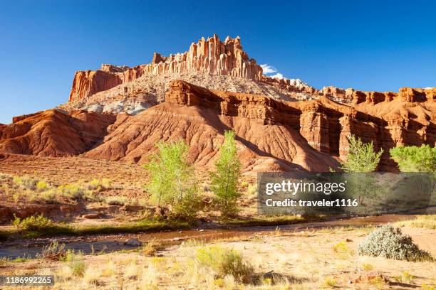 the castle rock formation in capitol reef national park in utah - capitol reef national park stock pictures, royalty-free photos & images