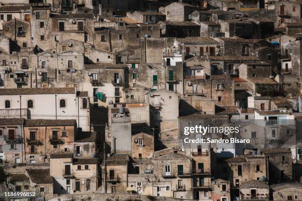 modica houses old town in sicily italy - modica foto e immagini stock