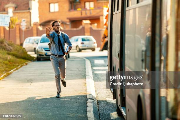 chasing bus - moving after stock pictures, royalty-free photos & images