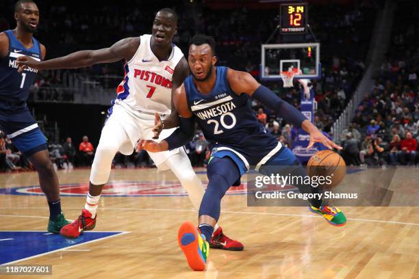 Josh Okogie of the Minnesota Timberwolves tries to get around the defense of Thon Maker of the Detroit Pistons during the first half at Little...