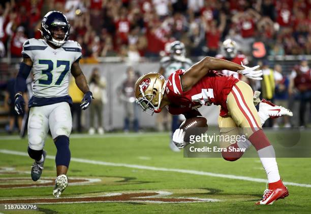 Wide receiver Kendrick Bourne of the San Francisco 49ers scores a touchdown the first quarter over the defense of defensive back Quandre Diggs of the...