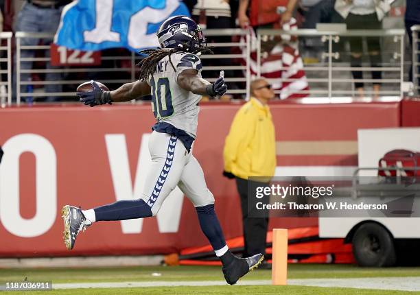 Defensive end Jadeveon Clowney of the Seattle Seahawks recovers a fumble to score a touchdown over the San Francisco 49ers during the second quarter...