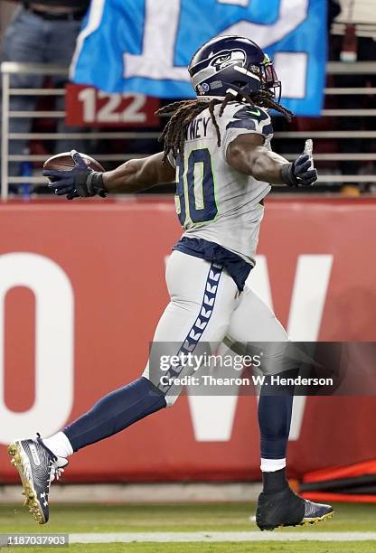 Defensive end Jadeveon Clowney of the Seattle Seahawks recovers a fumble to score a touchdown over the San Francisco 49ers during the second quarter...
